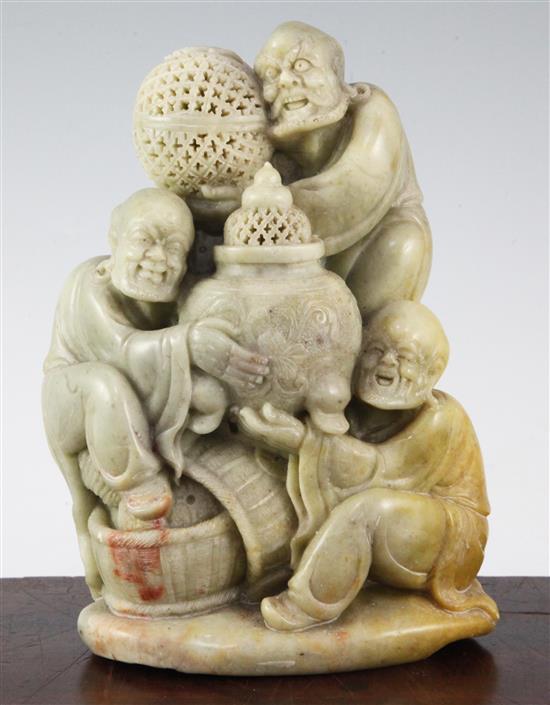 A Chinese soapstone group of three Luohan, 20th century, 22cm